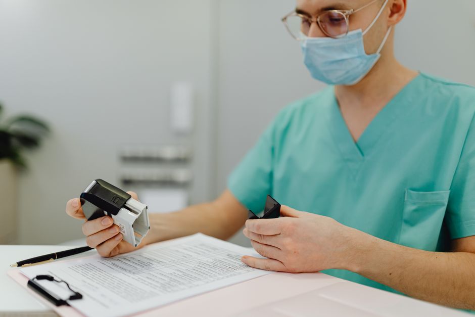 doctor reviewing medical paperwork clipboard CDL truck driver health