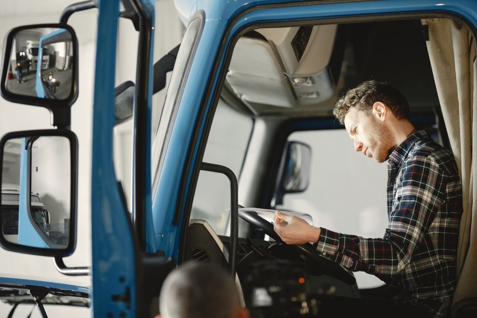 truck driver reading documents cab CDL truck driver health